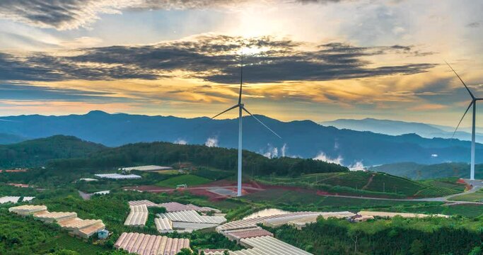 Time lapse of wind turbines on the top of the hill in the morning. This is a clean energy source that does not pollute the environment to serve electricity for people