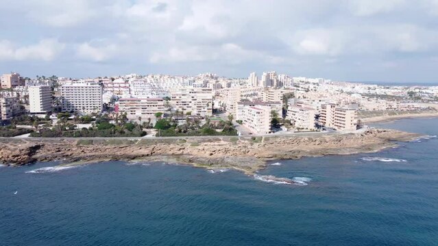 Aerial drone panorama over the sea with Cabo Cervera and La Mata beach in the distance at Torrevieja, Spain