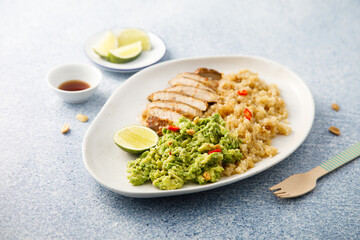 Grilled chicken with quinoa and mashed avocado