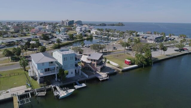 4K Drone Video (Tilt Shot) of Waterfront Homes on Canals in Hudson Beach on the Gulf of Mexico in Florida