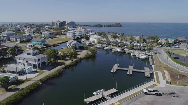 4K Drone Video (High Speed Dolly Shot) of Waterfront Homes on Canals in Hudson Beach on the Gulf of Mexico in Florida