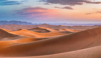 Panoramic shot of grand desert, the sweeping dunes smooth curves against backdrop of pastel twilight hues