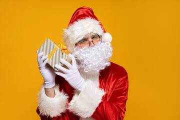 Santa Claus, with gift boxes in his hands.