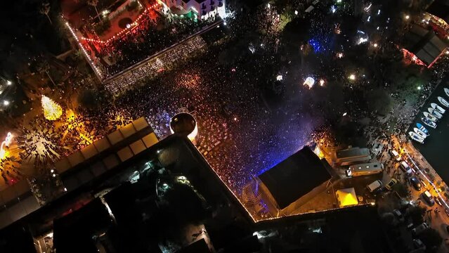 Aerial top view of the crowd on night celebration event concert, 4k
