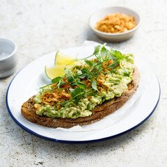 Healthy avocado toast with onion crunch