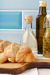 Fresh bread on wooden cutting board in the kitchen