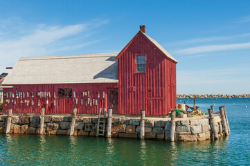 Red fishing shack on Bradley Wharf in the harbor town of Rockport, Massachusetts, USA