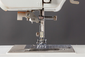 Sewing machine, stitching fabrics, needle in a round plan