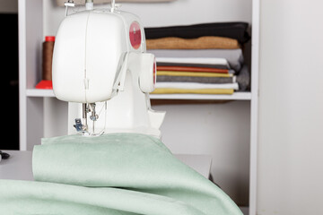 Sewing machine, stitching fabrics, needle in a round plan