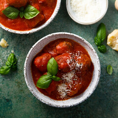 Homemade meatballs with tomato sauce and cheese