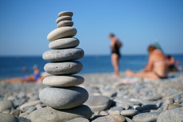 A tower of stones on the beach. Outdoor recreation.