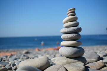 A tower of stones on the beach. Outdoor recreation.