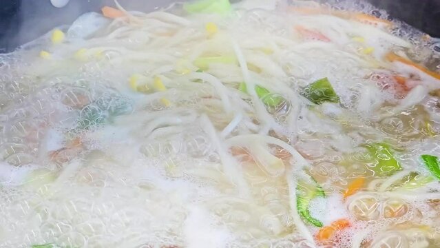 Seafood Kalguksu Boiling in Pot - Korean Knife Cut Noodle Soup