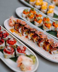 japanese sushi food. Maki ands rolls with tuna, salmon, shrimp, crab and avocado. Rainbow sushi roll, uramaki, hosomaki and nigiri. 