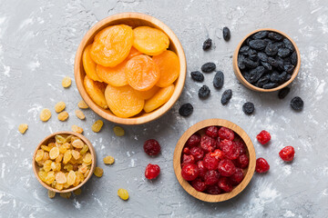 Bowl with different dried fruits on table background, top view. Healthy lifestyle with copy space