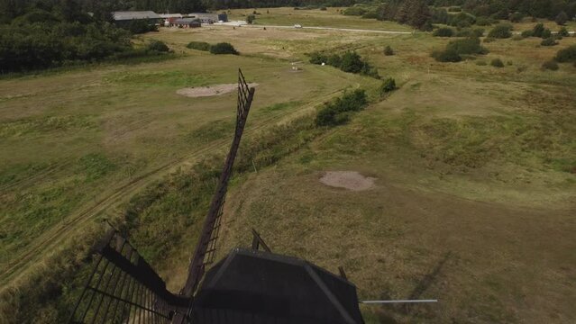 Faddersbol Molle, Thisted, Denmark - A Vista of Lush Surroundings Encircling the Antique Windmill - Aerial Pullback