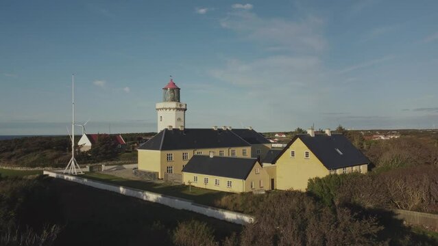 Hanstholm Fyr, Denmark - The Lighthouse is Nestled Within a Vibrant and Verdant Landscape - Drone Flying Forward
