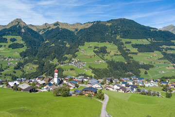 Fototapeta na wymiar Village of Raggal in the Grosswalsertal Valley, State of Vorarlberg, Austria. Drone Picture