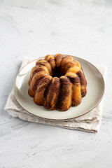 Homemade Marble Cake on a Plate, side view.