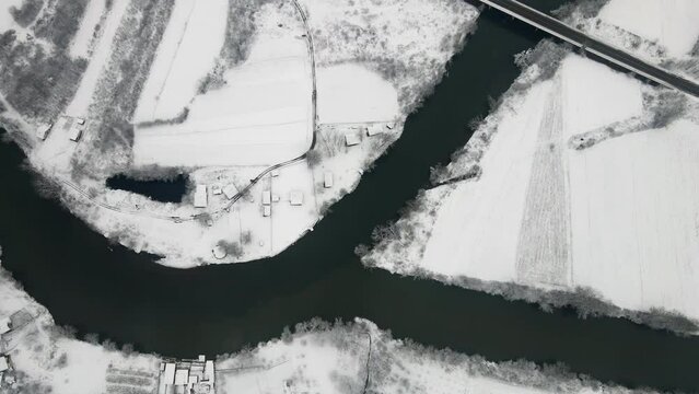 Top view of confluence of two rivers Ibar and West Morava, land covered in snow
