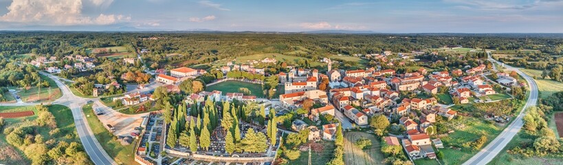 Drone panorama of the Istrian village of Svetvincenat with medieval castle in evening light