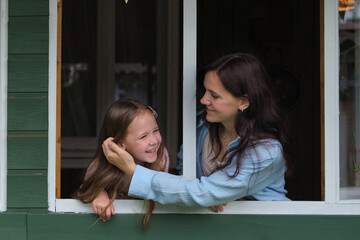 Cozy family time: young woman and child in a rustic setting