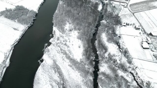 Drone shot of the river Ibar in a winter landscape