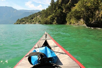 first person view kayaking on a lake in the alps