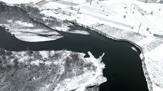 Drone shot of the river Ibar in a winter landscape