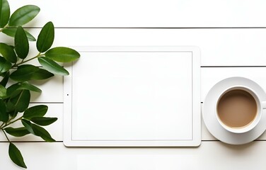 white tablet with empty screen, coffee cup, plant leaves herb on white wooden table, office work concept