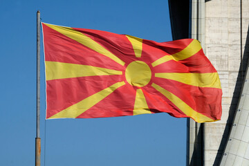 The national flag of North Macedonia waving in the wind in Skopje