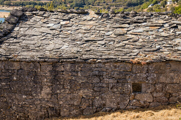 Old and large typical mountain house with dry stone schist walls with a stone roof. Chandrexa de Queixa. Ourense