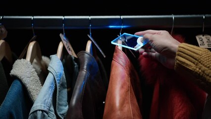 Man validating discount prices for clothes 