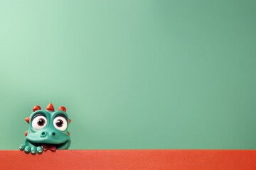 Head of cute little green Dragon looking through red paper on background with copy space