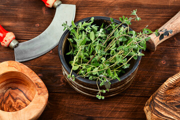 Fresh marjoram leaves on the table.
