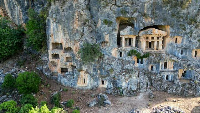 Ancient Lycian rock tombs in Pinara ancient city, Fethiye - Turkiye.