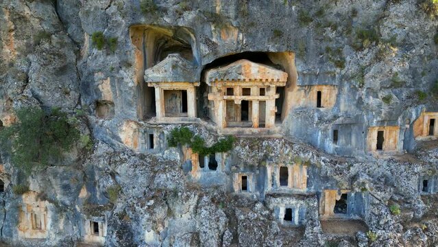 Ancient Lycian rock tombs in Pinara ancient city, Fethiye - Turkiye.