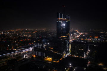 Aerial cityscape of Gdansk Przymorze with the Baltic Sea view at night, Poland.