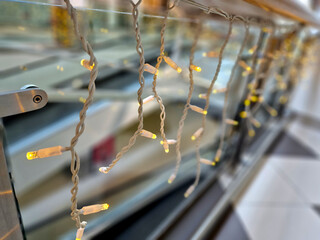 led chains in dense spacing on coiled and attached to the metal structure. creates light surfaces...