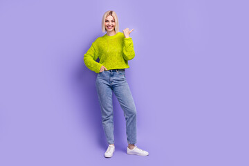 Full length photo of sweet shiny lady wear green pullover showing thumb empty space isolated purple color background