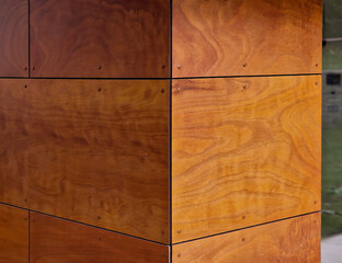 wall cladding using natural wooden boards. veneered plywood in rectangular boards warms the surface of the walls, corner