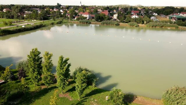 Aerial footage of a pond in a village Maglic in Serbia in sunny summer day
