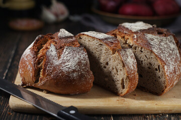 A loaf of rye bread in low key