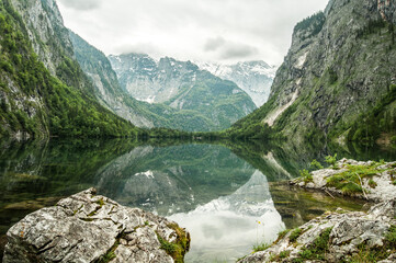 Naklejka na ściany i meble Mountain lake, reflection of the mountains around. 