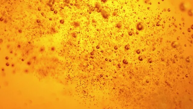 Close-up of beer pouring into glass. Lager foamy beer with bubbles rising upwards. Concept of beer drink, brewery, taste, bar, degustation, festival, drink texture. Vertical layout