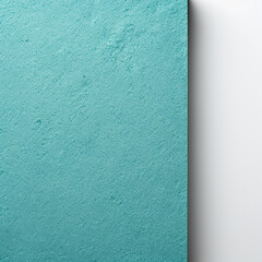 Fototapeta premium Texture of craft teal blue paper background with white border, macro. Structure of cardboard with empty orange frame.