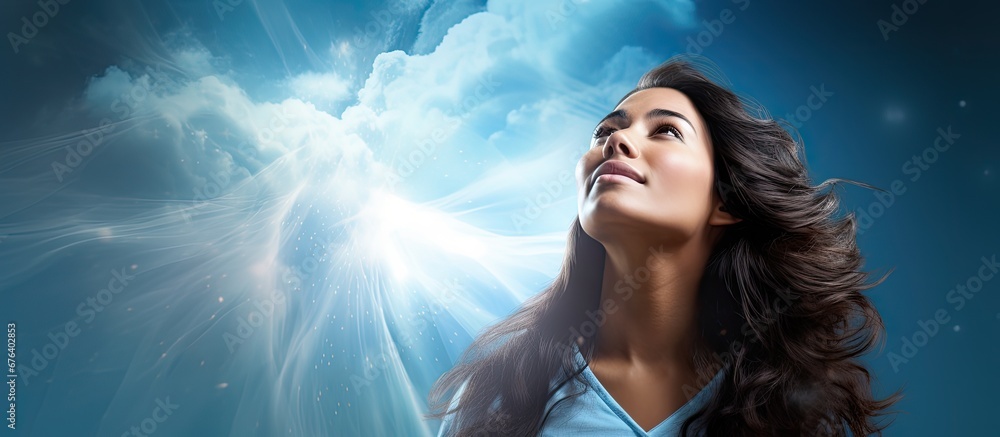 Fototapete a woman with flowing hair gazes up at the sky captivated by a digital banner displaying a graphic of