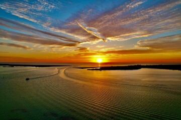 The drone photos of a beautiful sunset at Dunedin Causeway Beach, Tampa Bay, Florida.