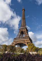 Fototapeta na wymiar Eiffel Tower, blue sky with white clouds