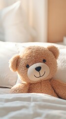 A teddy bear is sitting on a cozy bed